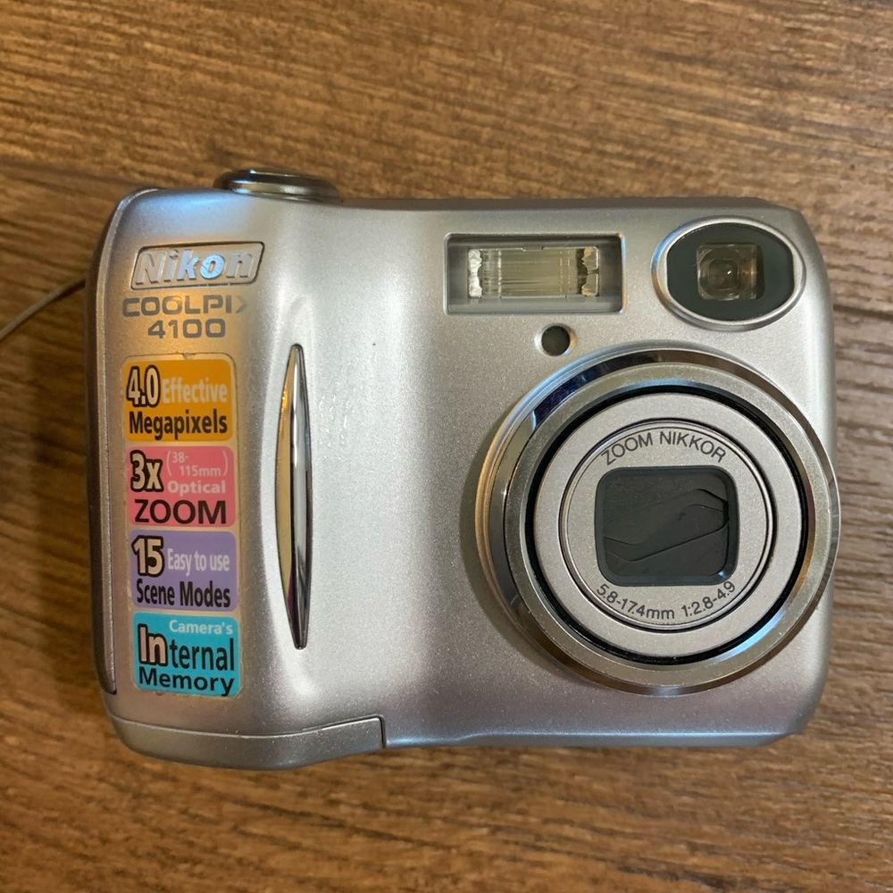 Nikon digital camera. Good shape. Bag slightly stained.
